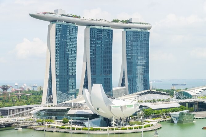 Marina Bay Sands, the lotus-shaped ArtScience Museum and the Helix Bridge seen across the bay by day