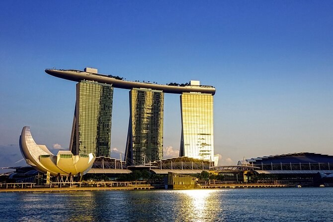 The Marina Bay skyline at dusk, with Marina Bay Sands and the financial district reflected in the water
